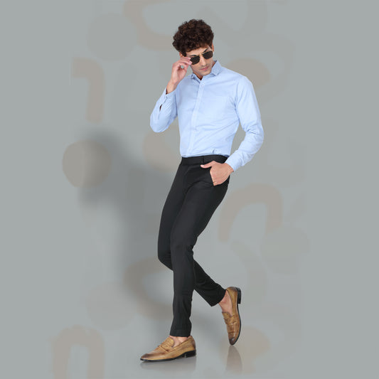 Men's Slim Fit Black Formal Trousers styled on a model in a studio setting. The image shows the plain cotton fabric and a slim silhouette.