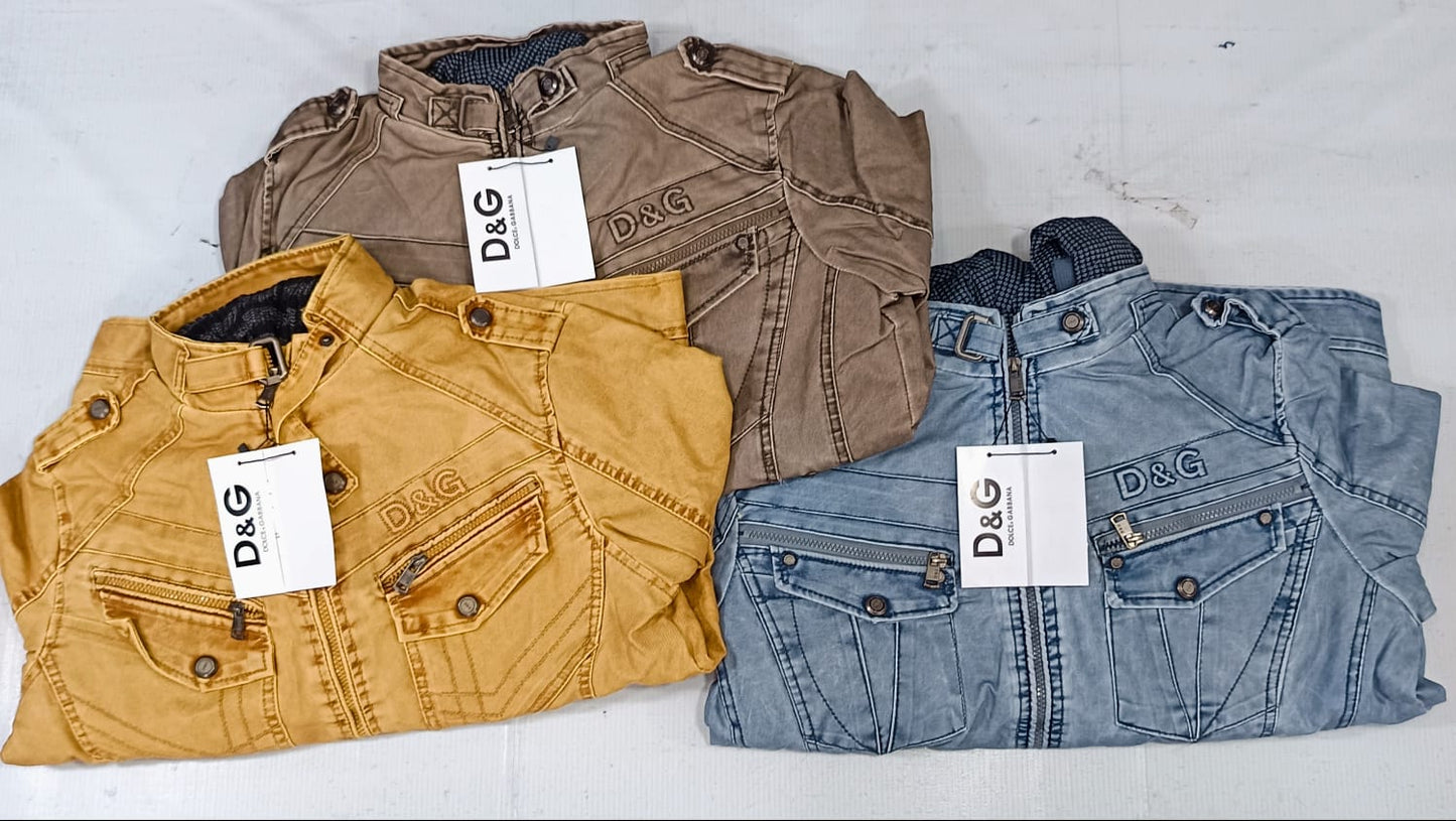 Three folded jackets in brown, yellow, and blue with D&G labels on a white background
