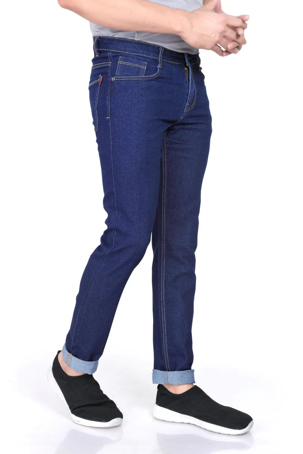 A close-up shot of a male model wearing LP Creation Men's Blue Denim Cargo Jeans, highlighting the fabric texture and pockets