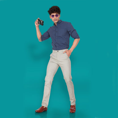 A man wearing Men's Straight Fit Cream Cotton Pants for a casual day out.

