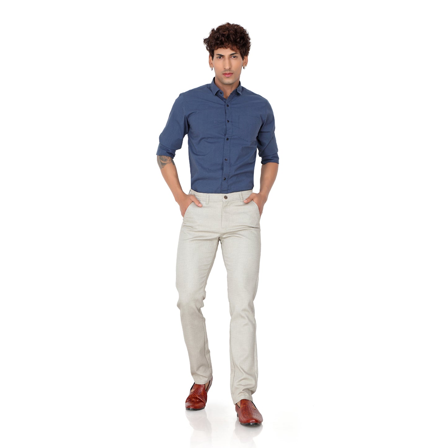 An executive wearing Men's Cream Cotton Trousers for a day at the office.

