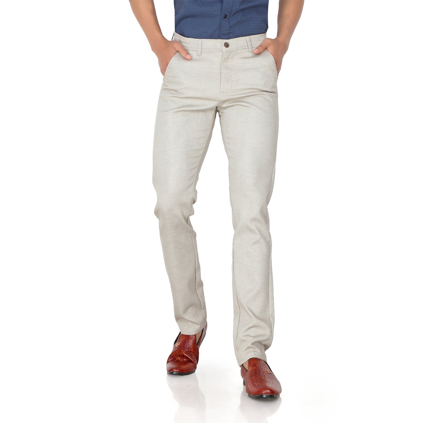 Close-up of the 100% cotton fabric and texture on the cream trousers.

