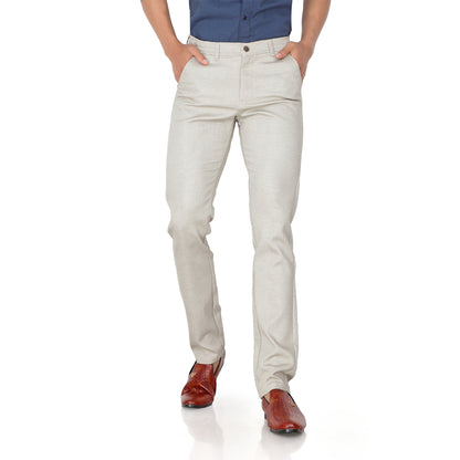 Close-up of the 100% cotton fabric and texture on the cream trousers.

