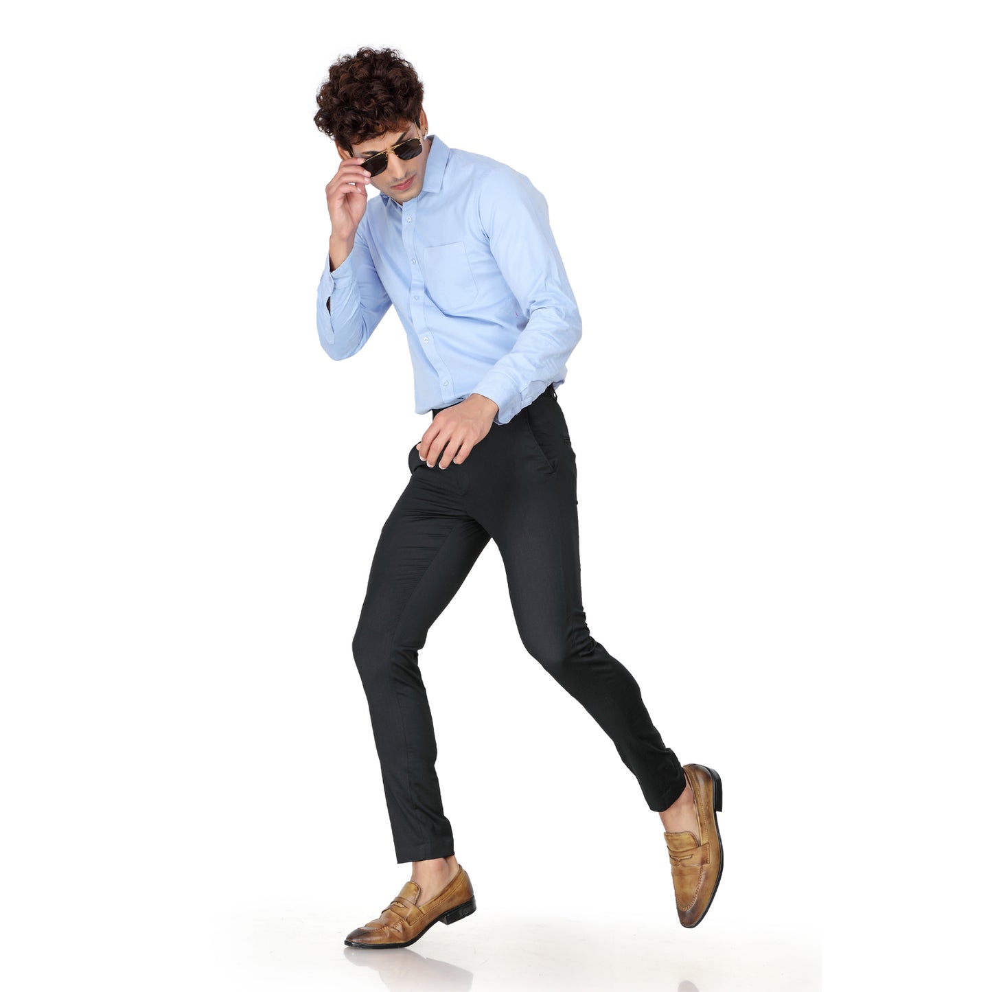 Close-up of the durable black cotton fabric and button closure of the men's formal trousers.