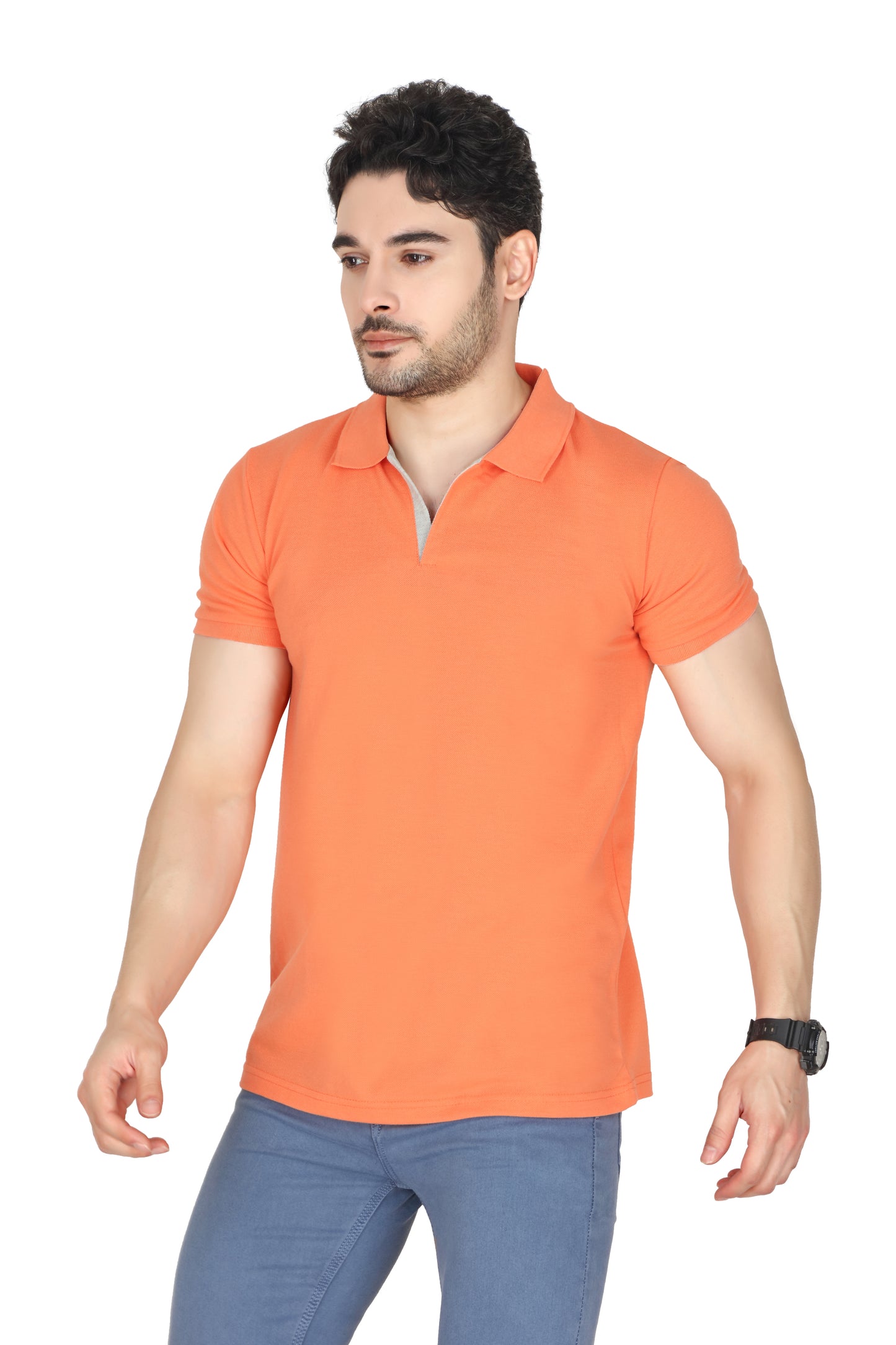 Man wearing an orange polo shirt and blue pants on a white background