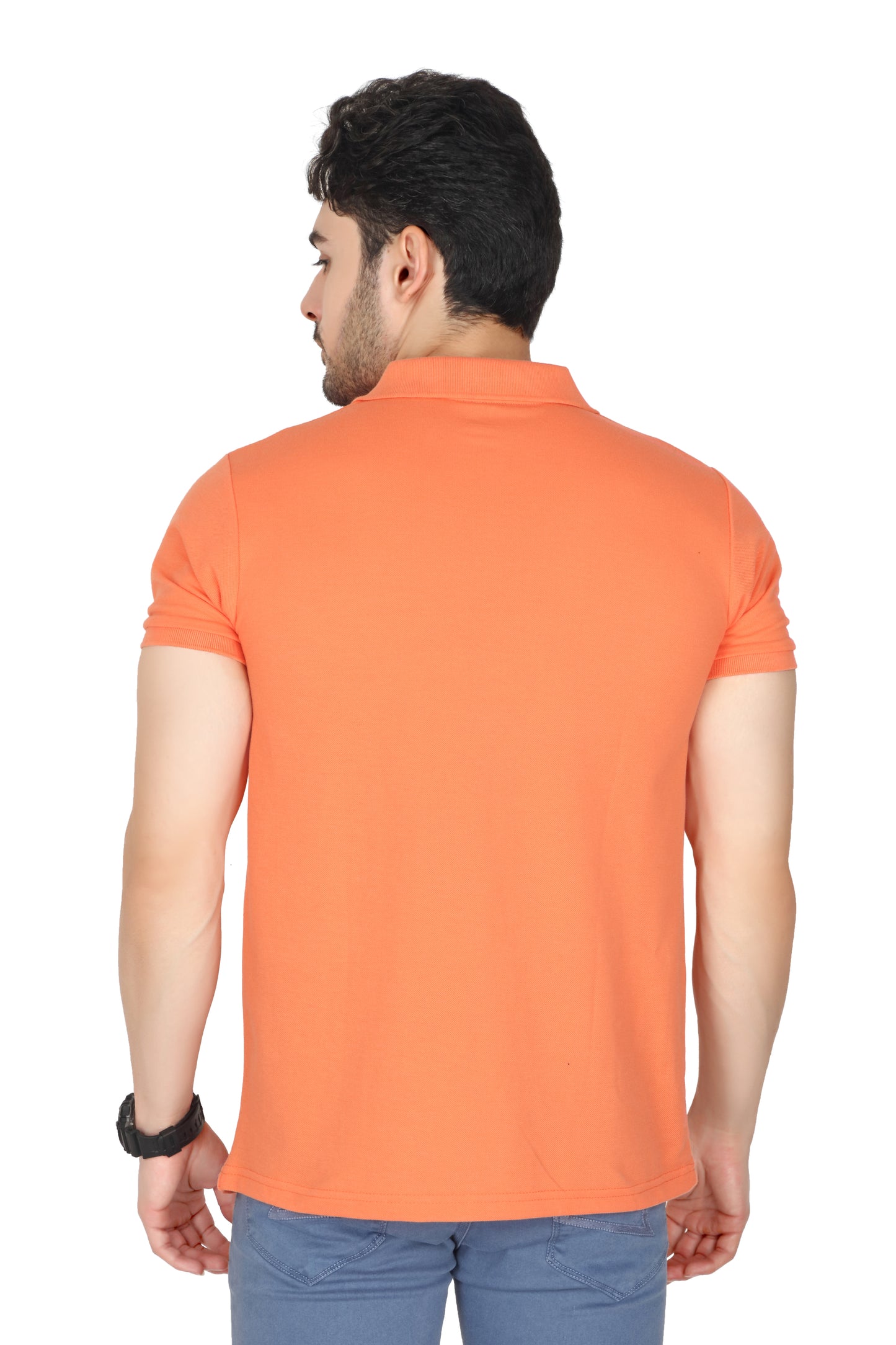 Man wearing an orange polo shirt on a white background