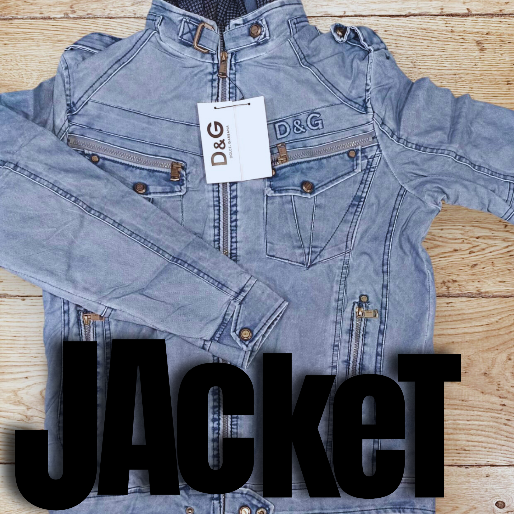 Denim jacket with D&G tag on a wooden surface